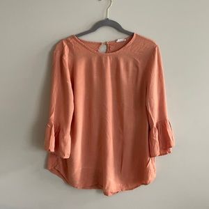 From Palmer Peach Ruffle Top